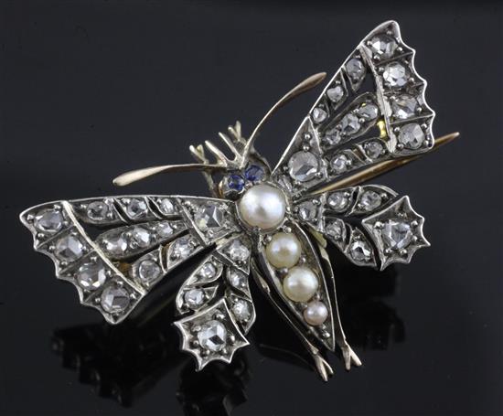 A Victorian style gold and silver, split pearl, sapphire and rose cut diamond set butterfly brooch, 36mm.